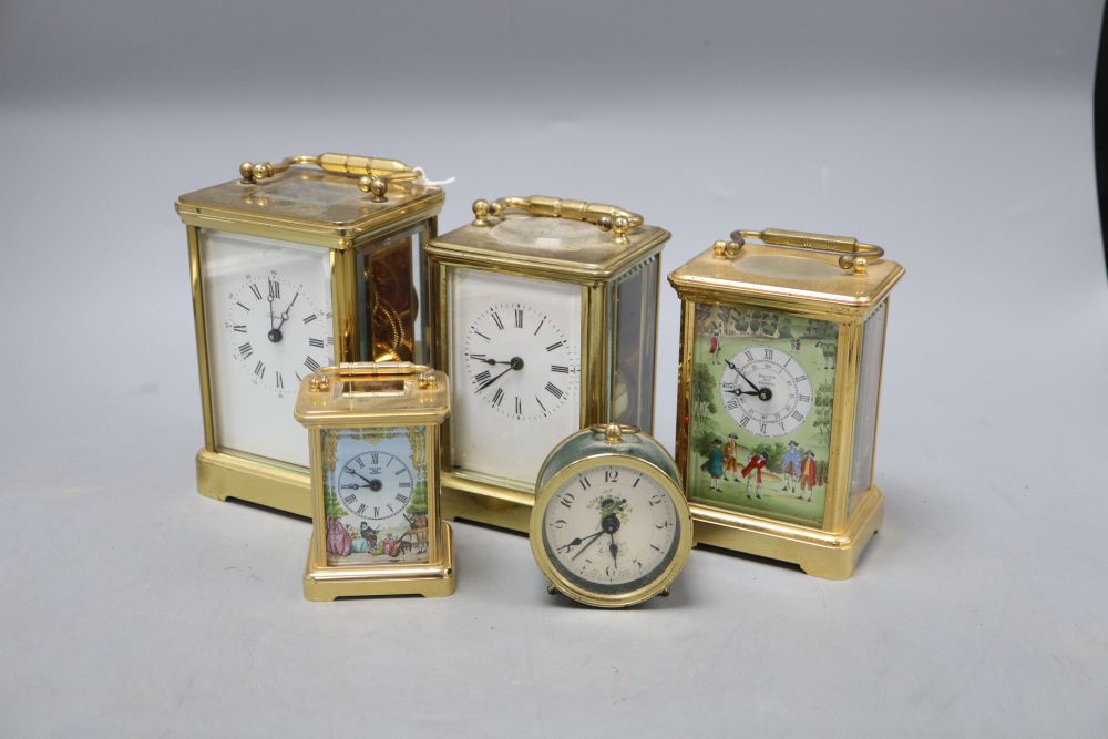 An Asprey brass cased carriage clock, another carriage clocks, two Halcyon Days carriage timepieces and an alarm clock, tallest 14cm (h